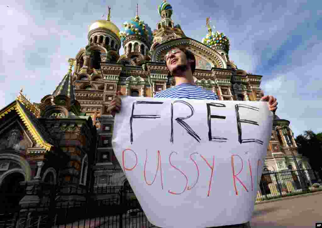 A demonstrator in front of the Savior of Spilled Blood Cathedral in St. Petersburg, Russia.