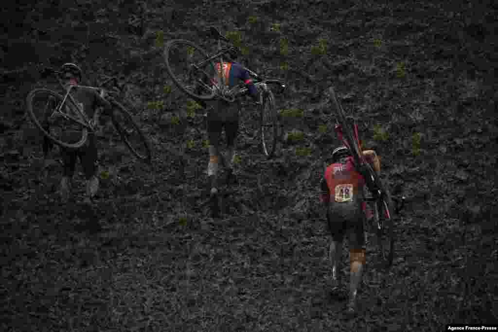 Riders compete during the Veterans Men's race at the UK Cyclo-Cross National Championships 2022 in Ardingly, south of London, Jan. 8, 2022.