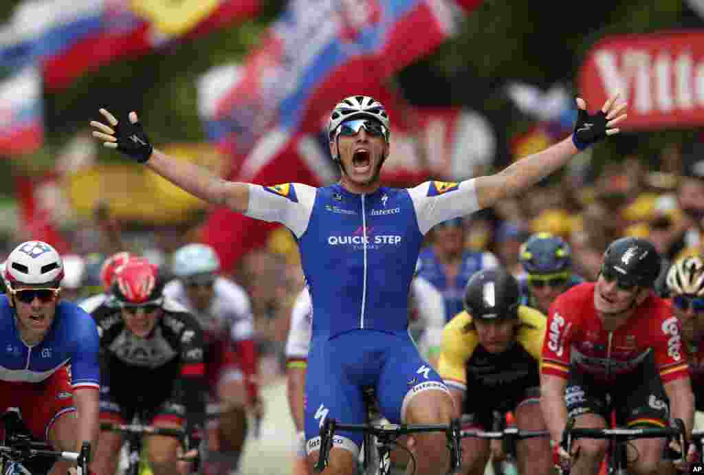 Germany's Marcel Kittel celebrates as he crosses the finish line to win the second stage of the Tour de France cycling race over 203.5 kilometers (126.5 miles) with start in Dusseldorf, Germany, and finish in Liege, Belgium.