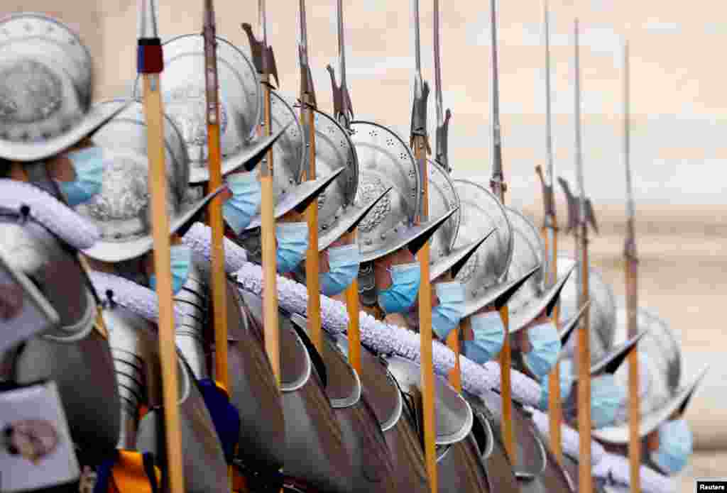 Members of the Pontifical Swiss Guard stand by at St. Peter's Square before Pope Francis delivers his traditional Christmas Day Urbi et Orbi speech to the city and the world from the main balcony of St. Peter's Basilica at the Vatican, Dec. 25, 2021.