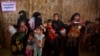 Rohingya Muslim refugee women with their children wait at a nutrition center to collect the diet for their children at Balukhali refugee camp 50 kilometres (32 miles) from, Cox's Bazar, Bangladesh, Jan. 23, 2018. 
