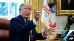 President Donald Trump speaks in the Oval Office o