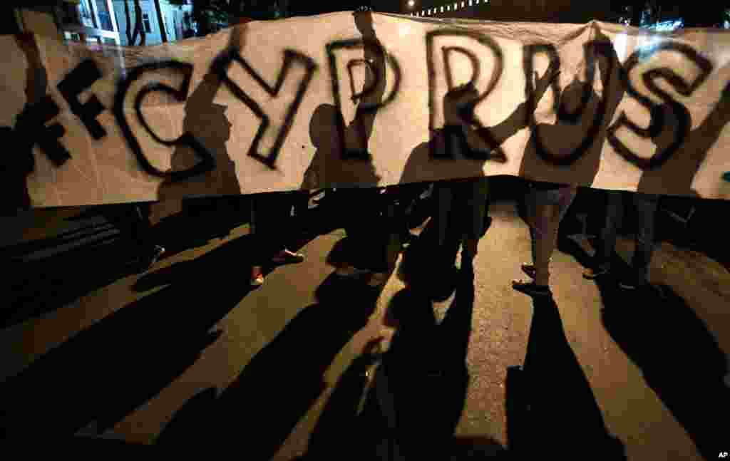 The European Central Bank's move calmed markets in Europe for months, but Cyprus's financial problems grew. The country's banks had taken losses from Greece's debt writedown, and the government was overwhelmed by the cost of supporting its banks.