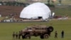 South African military personnel keep guard around the perimeter of Nelson Mandela's property in Qunu, as funeral preparations continue, Dec. 13, 2013.