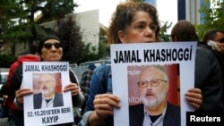 Human rights activists hold pictures of Saudi journalist Jamal Khashoggi during a protest outside the Saudi Consulate in Istanbul, Turkey, Oct. 9, 2018.