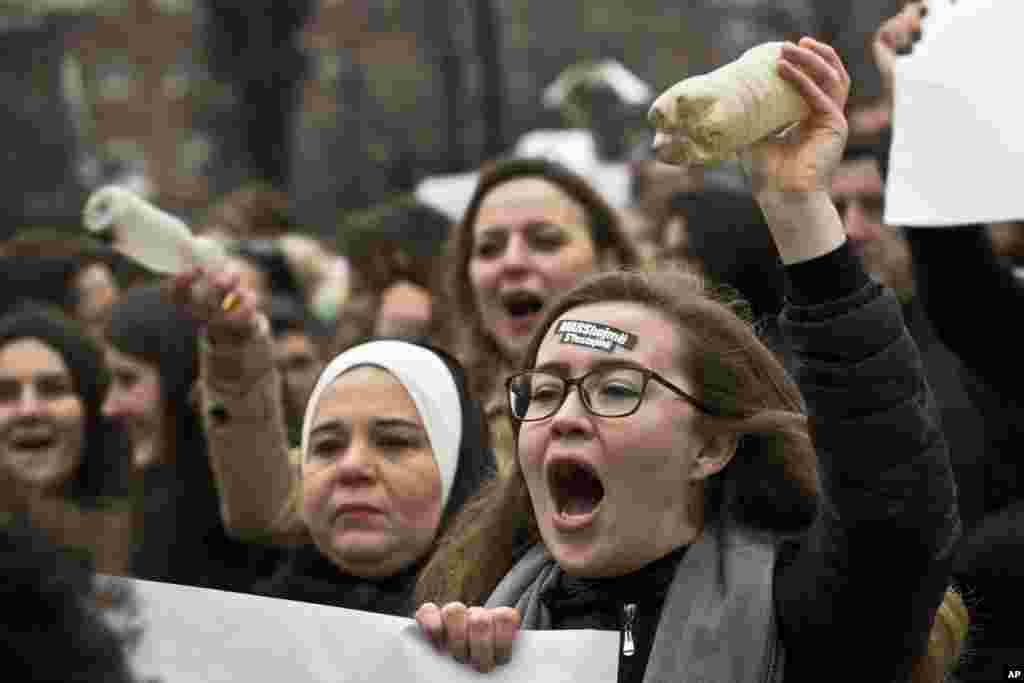 Kosovo feminist with a sticker on her forehead reading "We March we don't celebrate" march on the occasion of the International Women's Day in Pristina, Kosovo, March 8, 2017. Kosovo feminists advocate for gender equality and protest against violence against women.