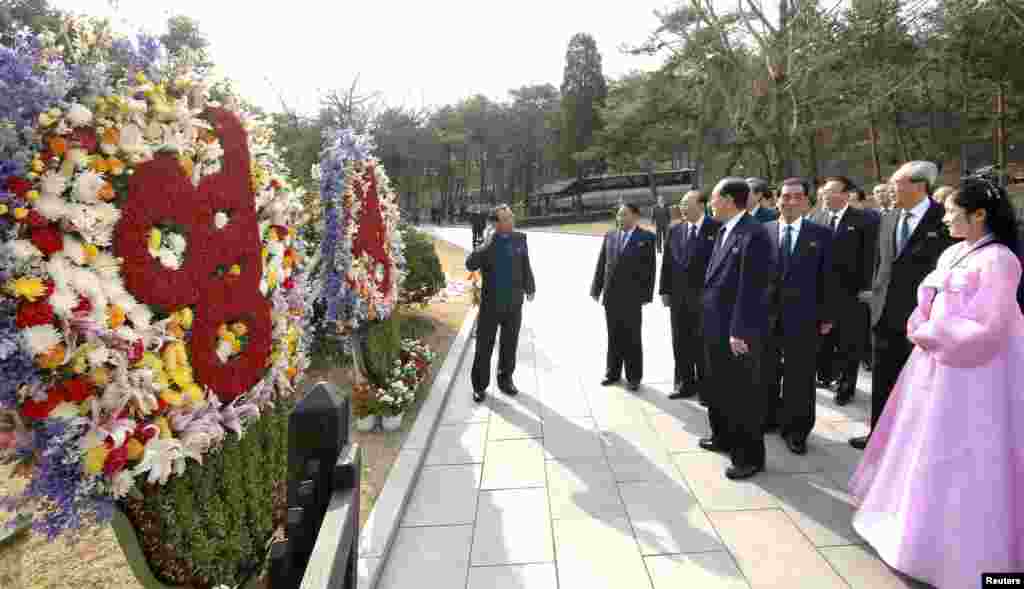 North Korean party officials visit Mankyongdae, the birthplace of North Korean founder Kim Il-sung, on the 101st anniversary of his birth, April 15, 2013.