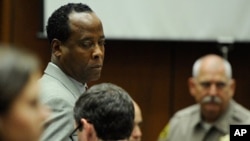 Dr. Conrad Murray prepares to leave for lunch recess on Nov. 3, after the prosecution delivered its closing arguments in Murray's involuntary manslaughter trial.