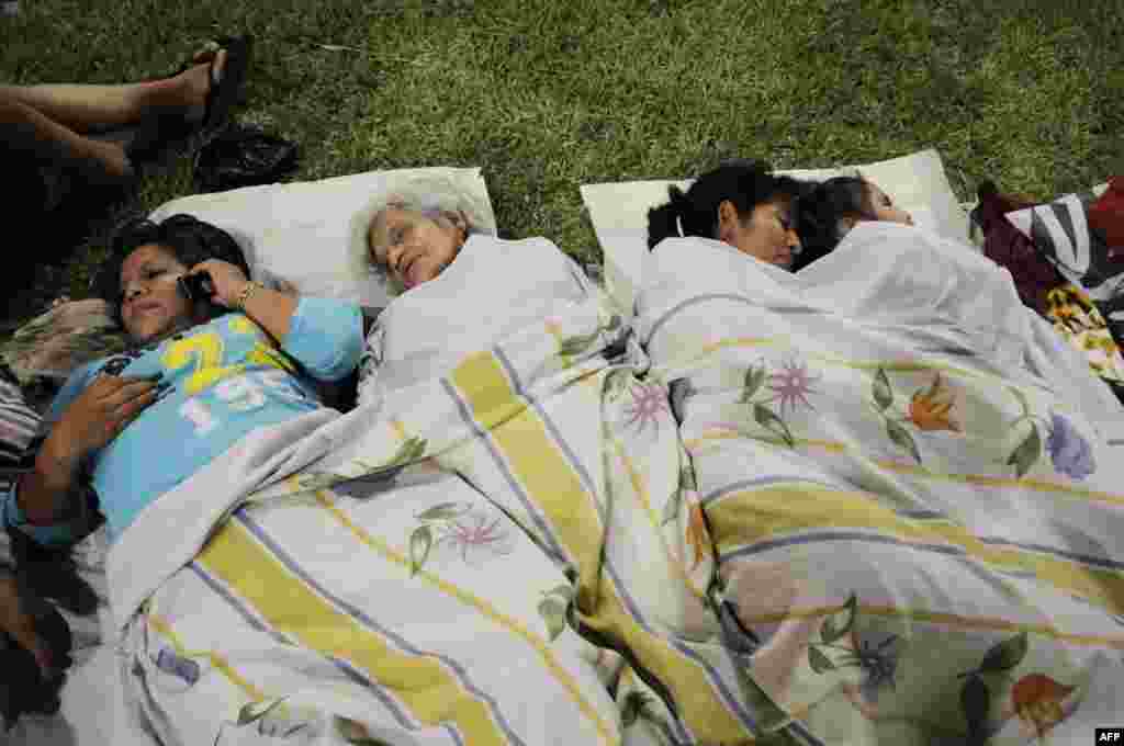People sleep in a park after an earthquake in the city of Guayaquil, April 17, 2016.