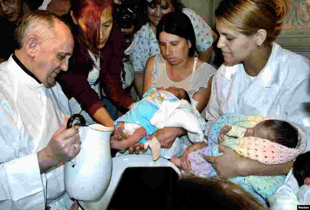 Then Argentine Cardinal Jorge Bergoglio washes the feet of two newly born children on Holy Thursday at the Buenos Aires' Sarda maternity hospital, March 24, 2005.