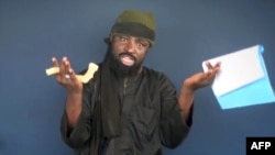 This screen grab image taken on February 18, 2015 from a video made available by Islamist group Boko Haram shows Boko Haram leader Abubakar Shekau making a statement at an undisclosed location. 