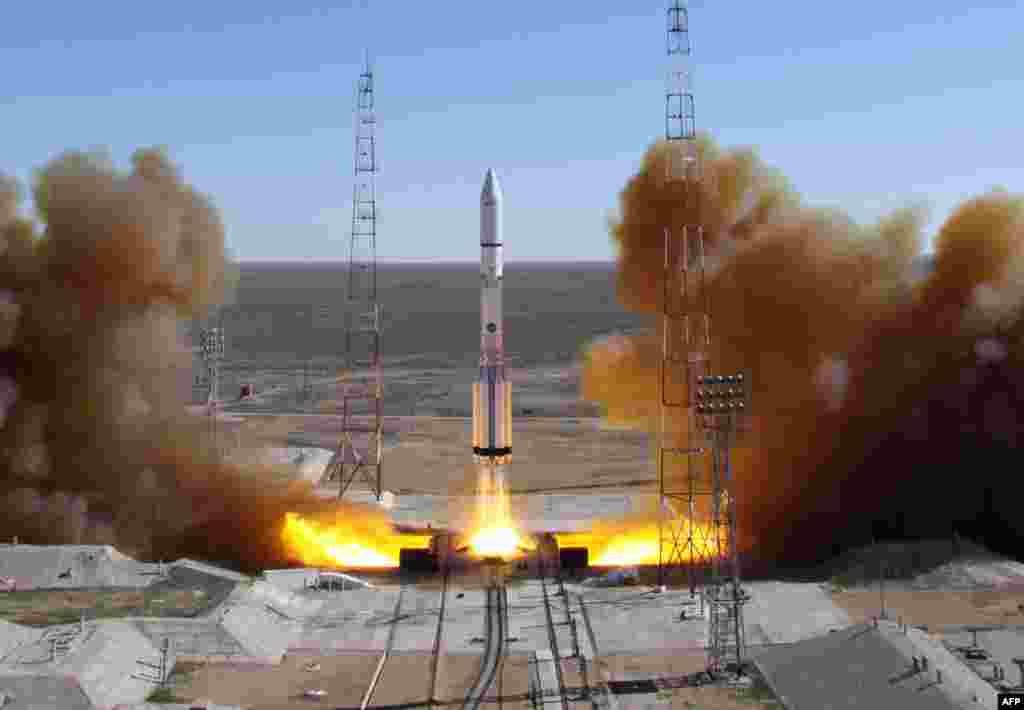 A Russian-built Proton rocket with Russian relay satellite Luch-5V and the Kazakh communication satellite KazSat-3 aboard blasts off from a launch pad in the Russian-leased Kazakhstan's Baikonur cosmodrome.